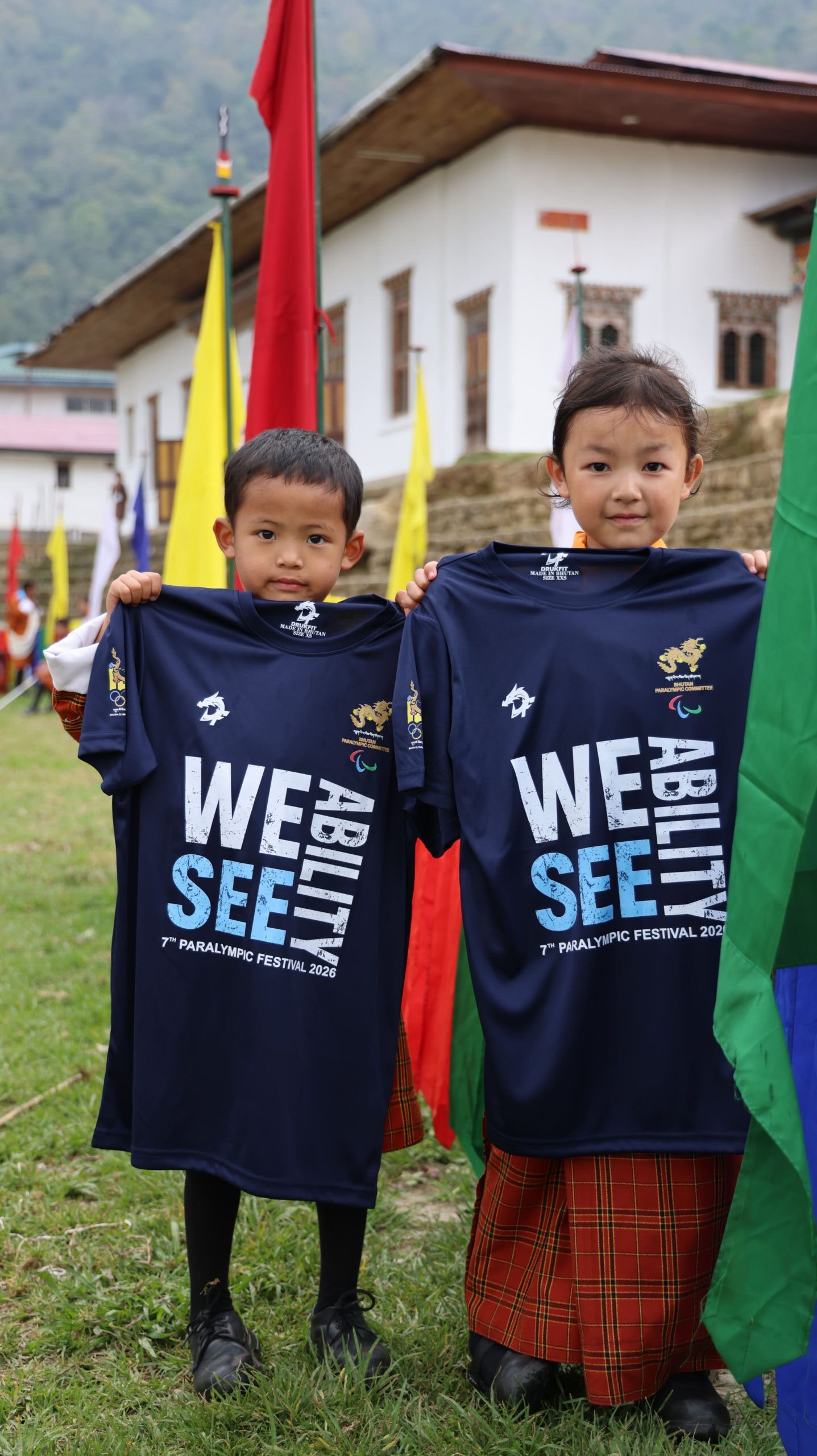 student holding 7th Paralympic Festival